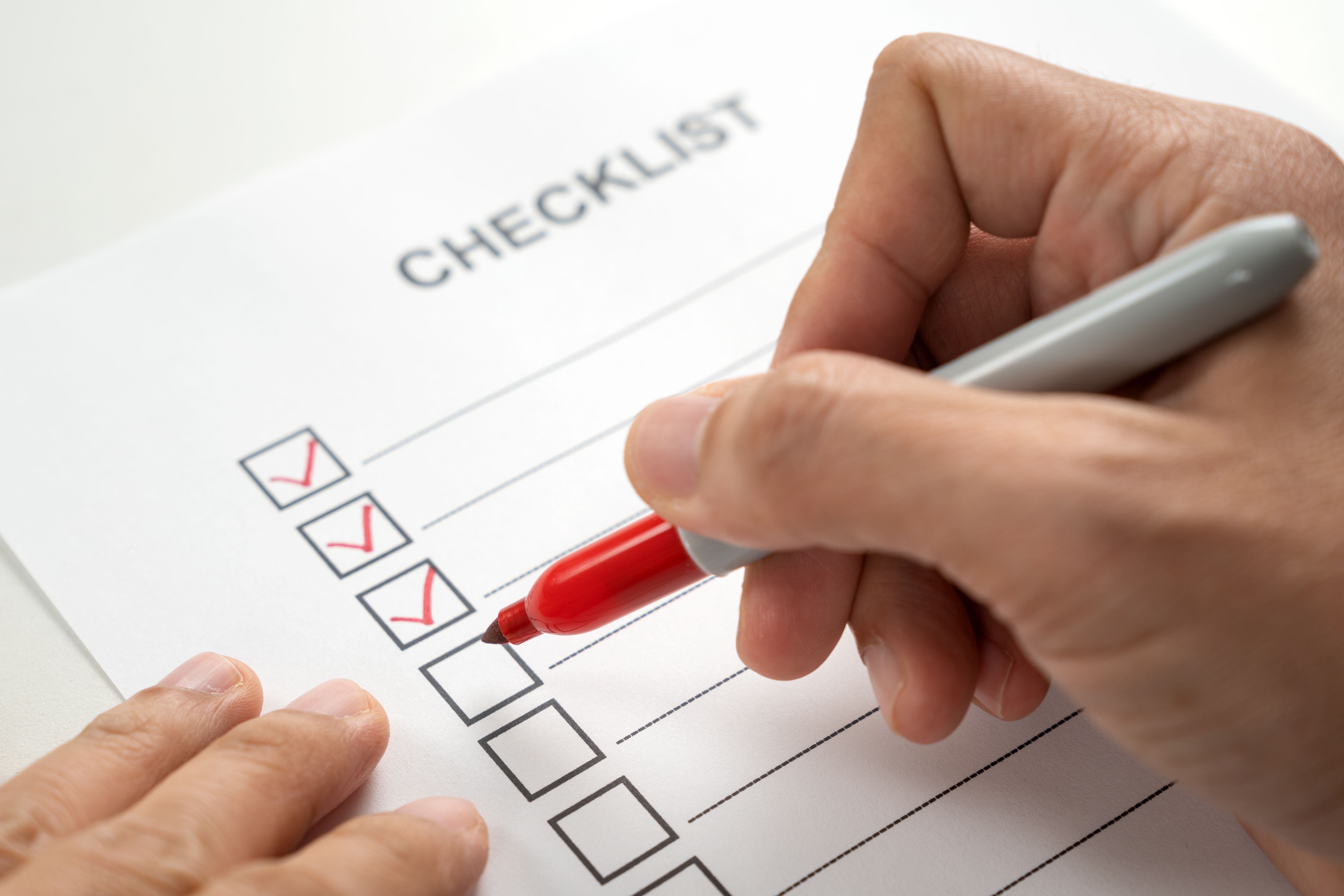 hand-with-red-marker-pen-marking-on-checklist-box-2024-12-13-18-33-26-utc.jpg